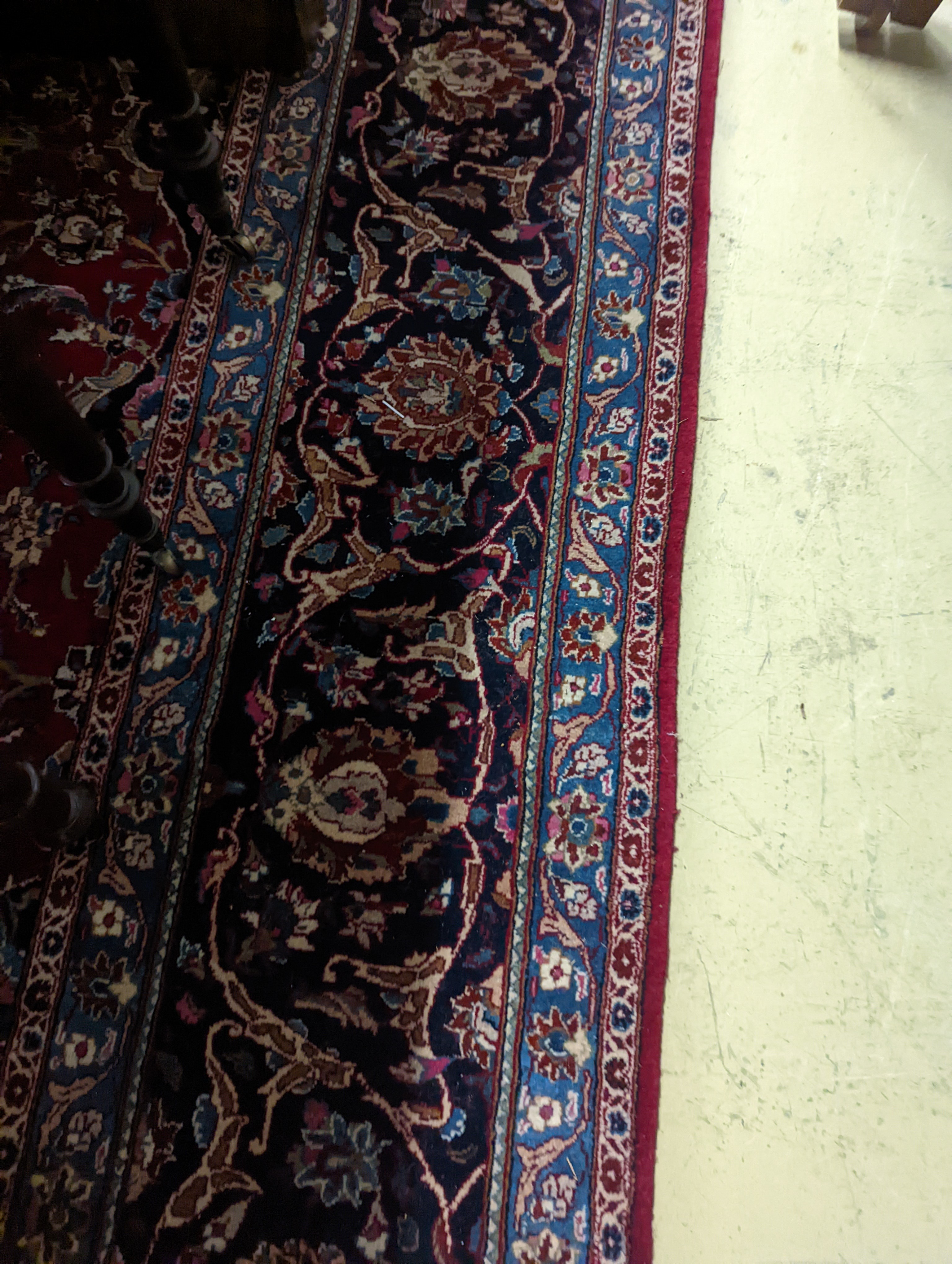 A Kashan burgundy ground carpet, 380 x 300cm